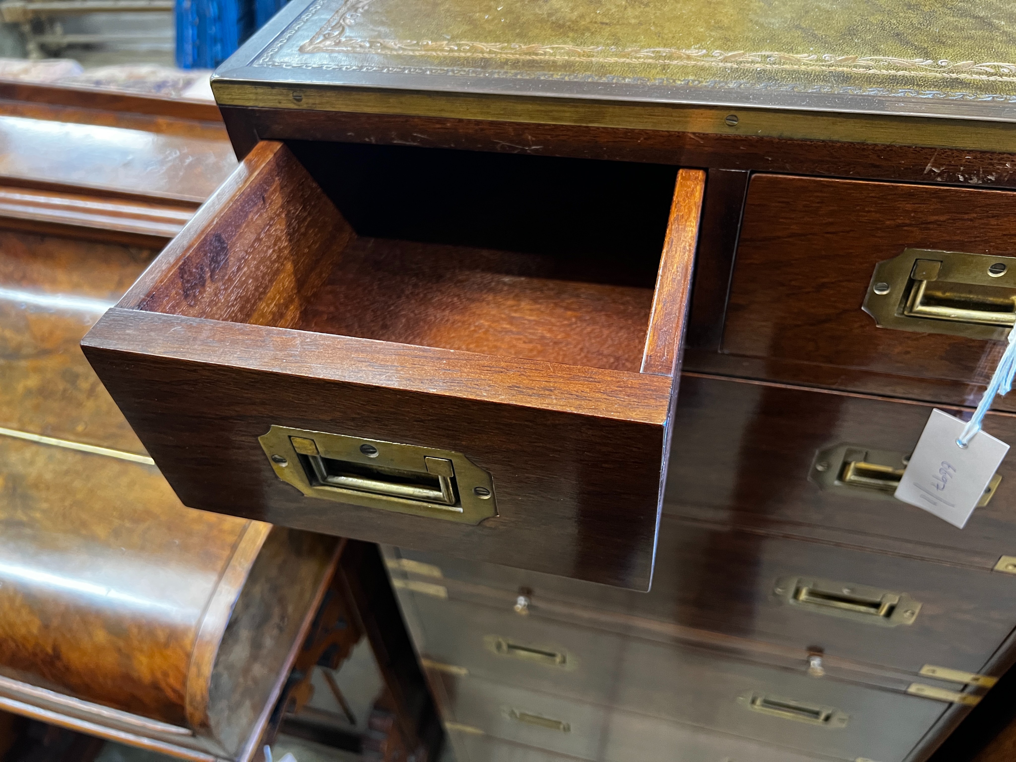 A narrow reproduction brass mounted mahogany military style chest fitted slide, width 46cm, depth 40cm, height 113cm